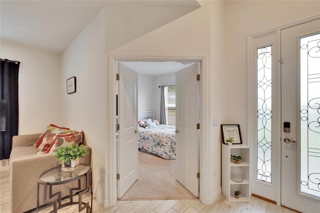 foyer with light hardwood / wood-style floors