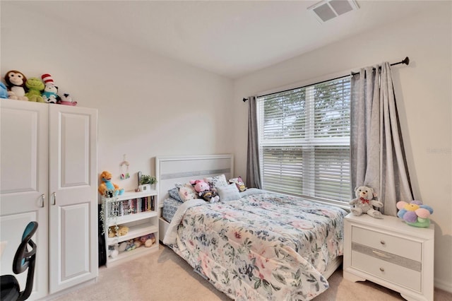 bedroom with light carpet