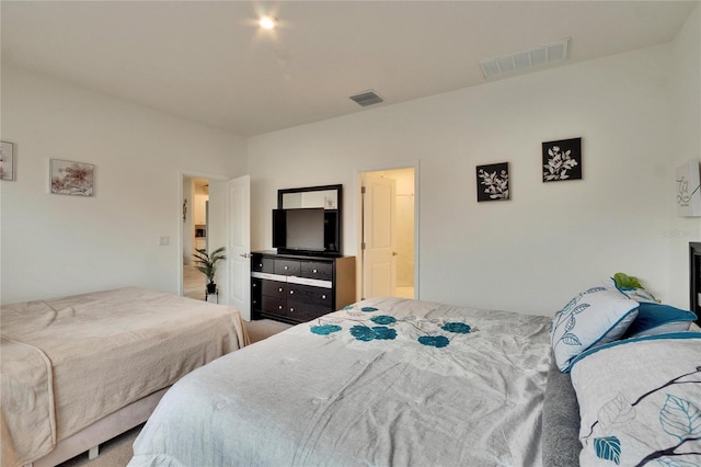 bedroom featuring ensuite bath