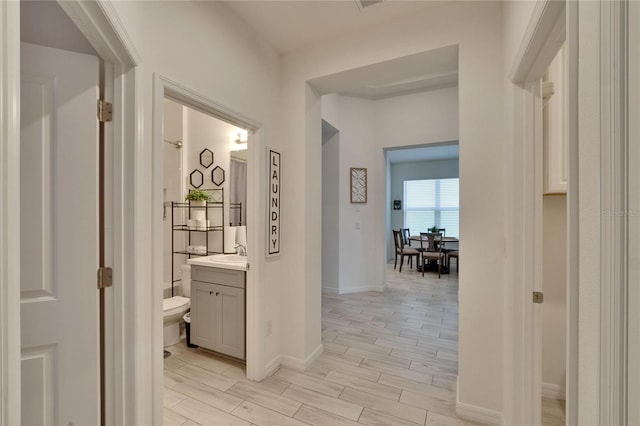 hallway featuring sink