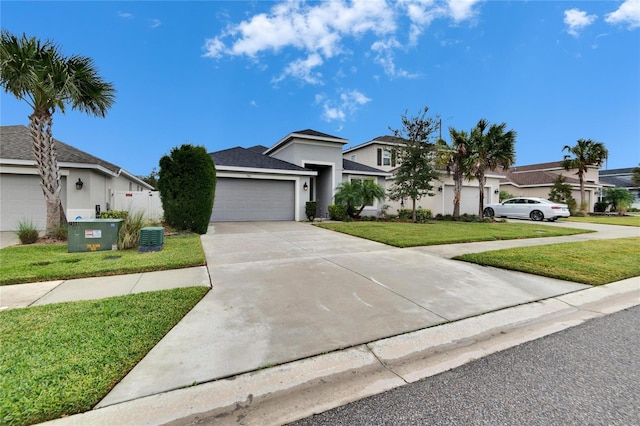 view of front of house featuring a garage and a front lawn