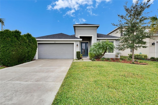 view of front of house featuring a garage and a front yard