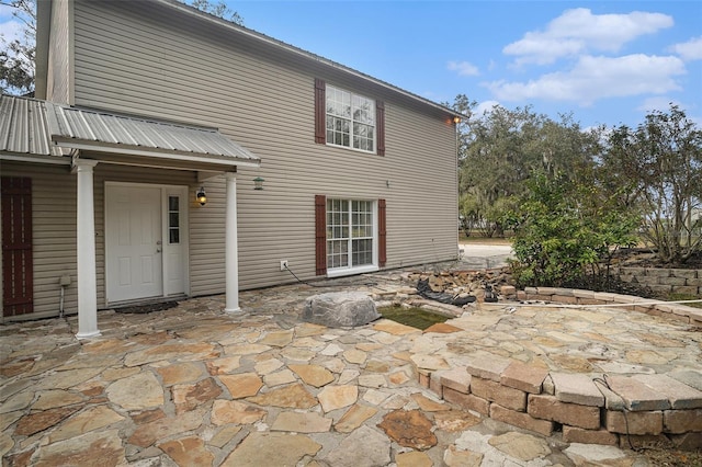 rear view of property featuring a patio