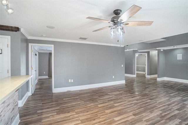 unfurnished living room with ornamental molding, dark wood-type flooring, a textured ceiling, and ceiling fan