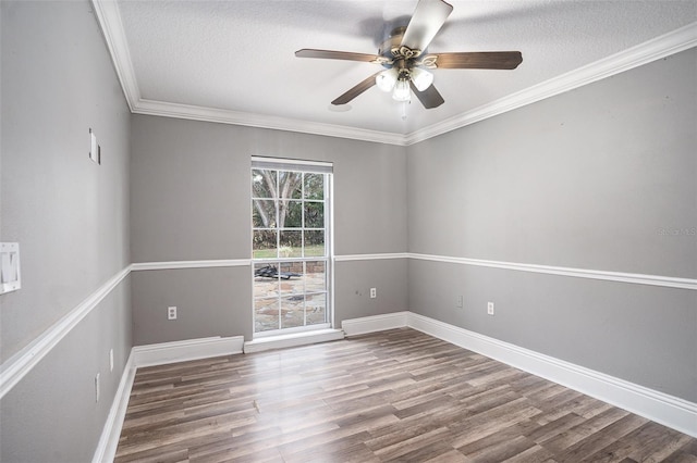 spare room with ceiling fan, ornamental molding, wood-type flooring, and a textured ceiling