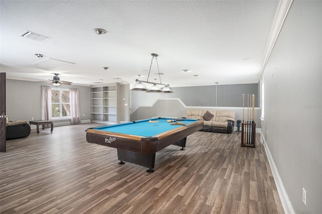 recreation room featuring pool table, hardwood / wood-style flooring, a textured ceiling, and built in shelves