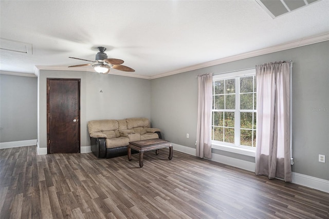 living room with crown molding, ceiling fan, and dark hardwood / wood-style flooring