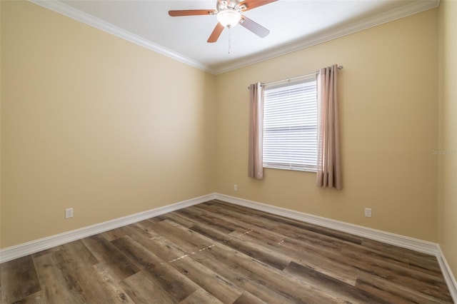 spare room with crown molding, ceiling fan, and dark hardwood / wood-style flooring