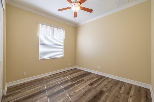 unfurnished room with ornamental molding, dark hardwood / wood-style floors, and ceiling fan