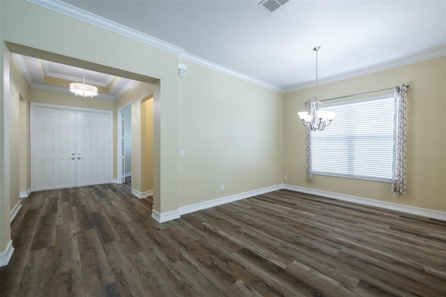 unfurnished dining area with ornamental molding, dark hardwood / wood-style flooring, and a chandelier