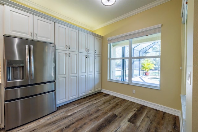 kitchen with white cabinetry, ornamental molding, dark hardwood / wood-style floors, and stainless steel fridge with ice dispenser