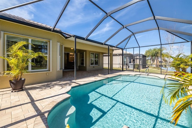 view of pool with a lanai and a patio area