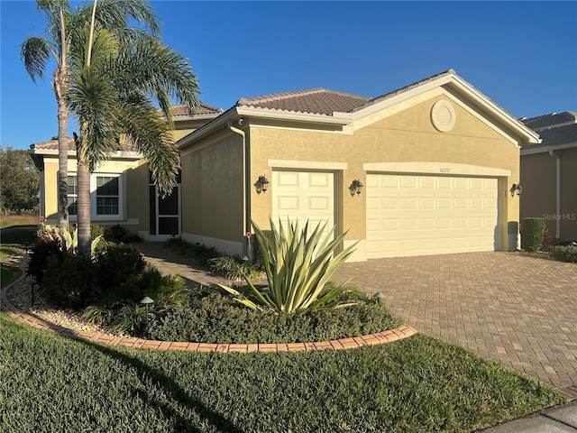 view of front of property with a garage