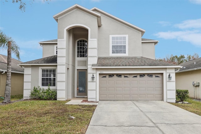 view of front of home with a garage and a front yard