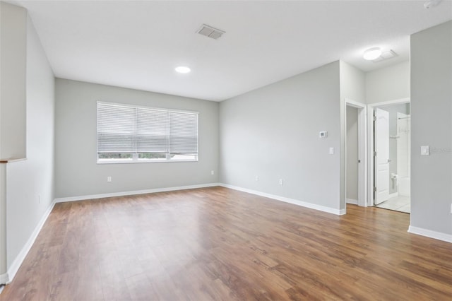 empty room with wood-type flooring