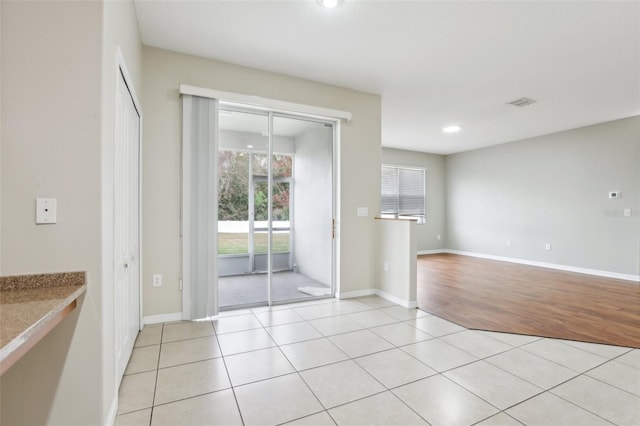 interior space with light tile patterned floors