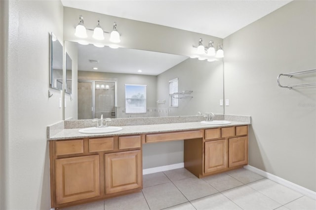 bathroom with vanity, a shower with shower door, and tile patterned floors