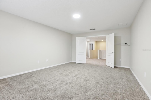 unfurnished bedroom featuring light carpet