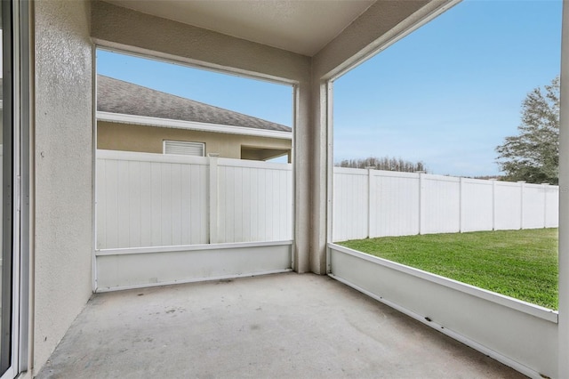 unfurnished sunroom with plenty of natural light