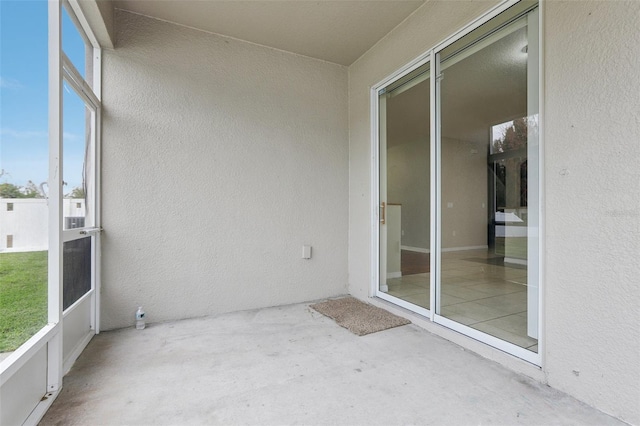 unfurnished sunroom featuring a healthy amount of sunlight