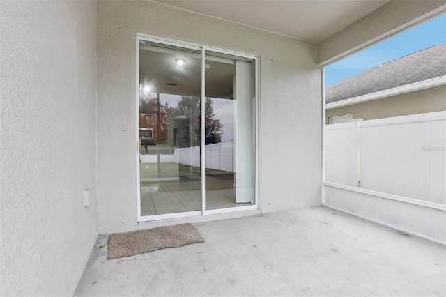 entrance to property with a patio area