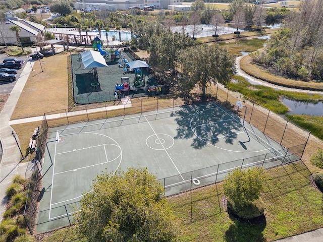 view of basketball court featuring a water view