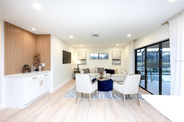 dining space featuring light hardwood / wood-style flooring