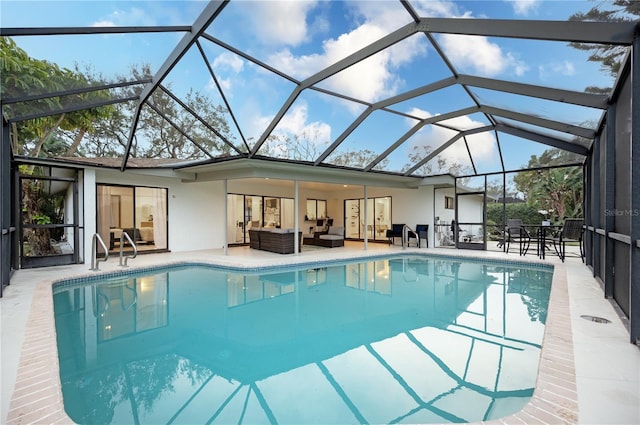 view of pool featuring an outdoor hangout area, a patio, and a lanai