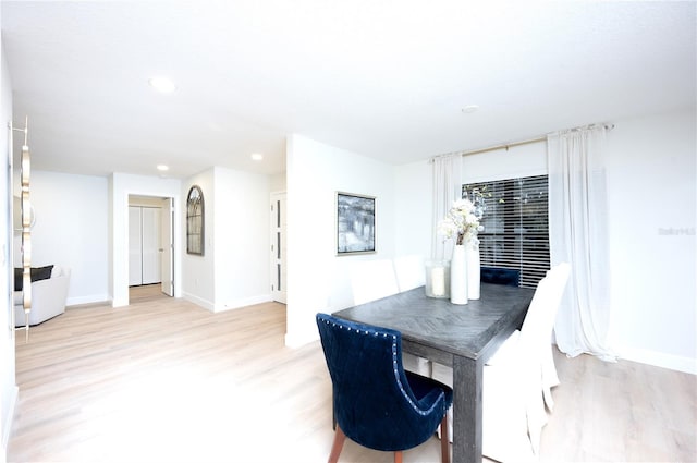 dining area with light hardwood / wood-style flooring