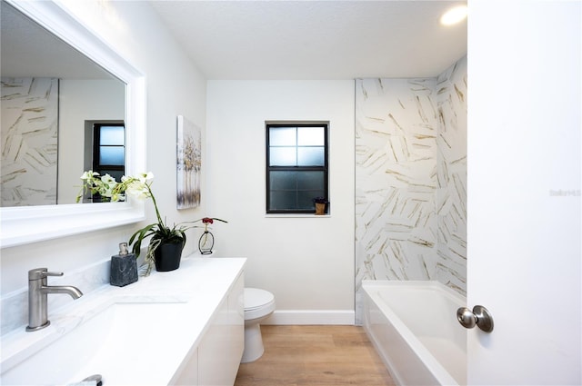 full bathroom with shower / tub combination, vanity, hardwood / wood-style floors, and toilet