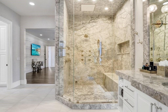 bathroom with vanity and a shower with shower door