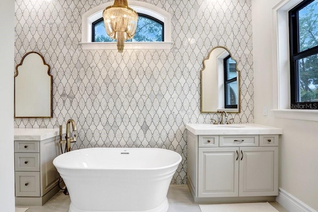 bathroom featuring vanity and a bath