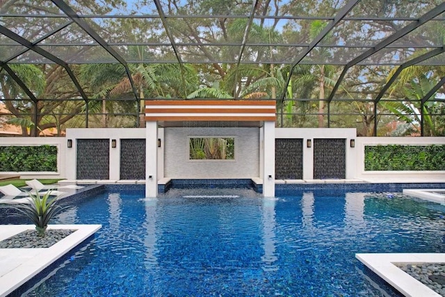 view of swimming pool with pool water feature