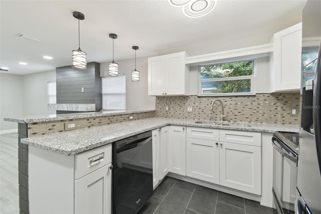 kitchen featuring black appliances, white cabinets, a peninsula, and tasteful backsplash