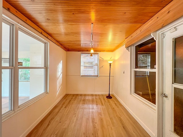 unfurnished dining area featuring light wood-type flooring