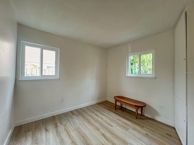 spare room with light hardwood / wood-style flooring