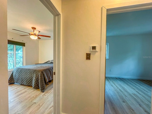 bedroom featuring ceiling fan and light hardwood / wood-style floors