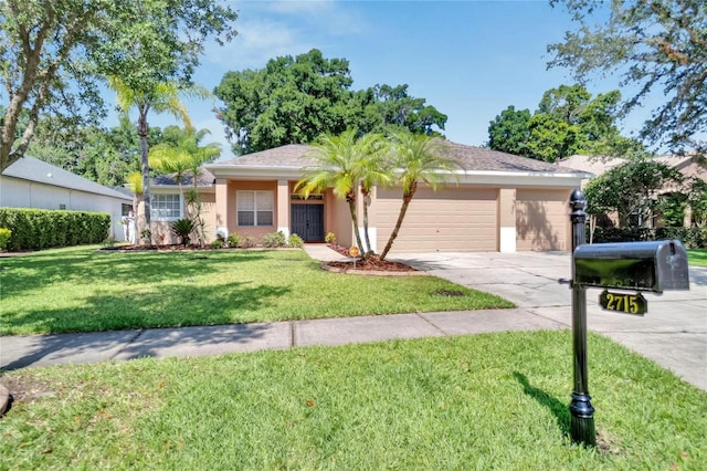 ranch-style home with a garage and a front lawn