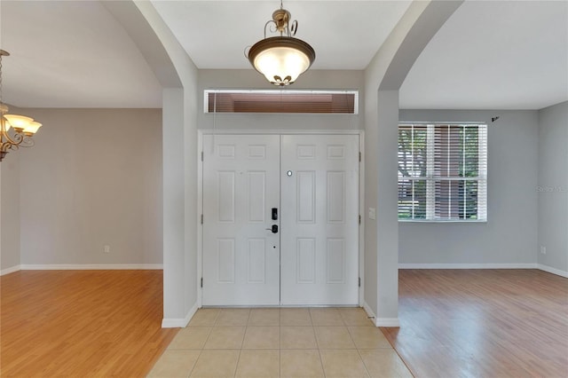 entrance foyer featuring a chandelier and light hardwood / wood-style floors