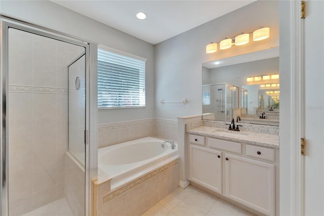 bathroom featuring tile patterned flooring, vanity, and independent shower and bath