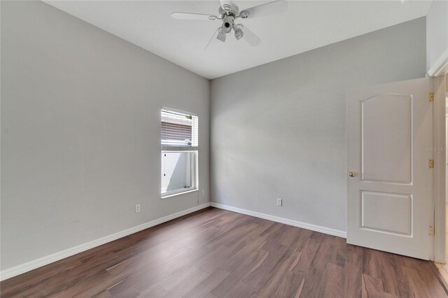 empty room featuring dark hardwood / wood-style floors and ceiling fan