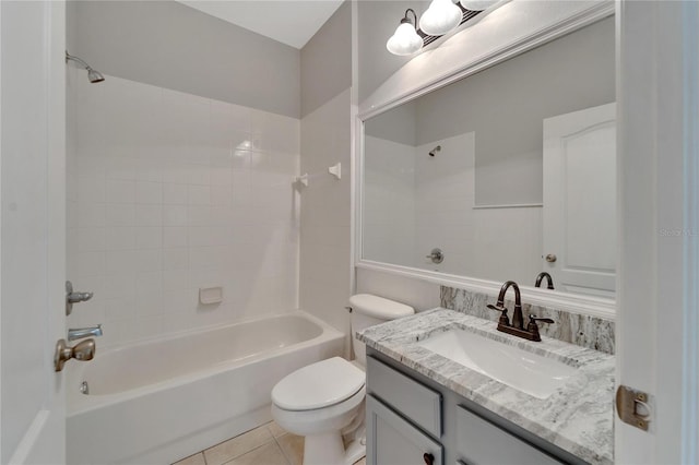 full bathroom featuring toilet, vanity, tile patterned floors, and shower / bathing tub combination