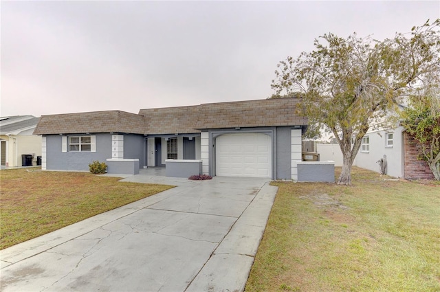 ranch-style house with a garage and a front yard