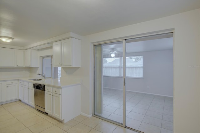 kitchen featuring light tile patterned flooring, sink, dishwasher, ceiling fan, and white cabinets