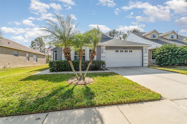 view of front of home featuring a garage and a front yard