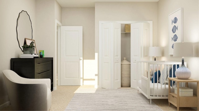 bedroom featuring a crib, light colored carpet, and a closet