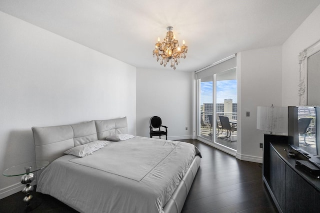 bedroom with dark wood-style floors, access to outside, baseboards, and an inviting chandelier