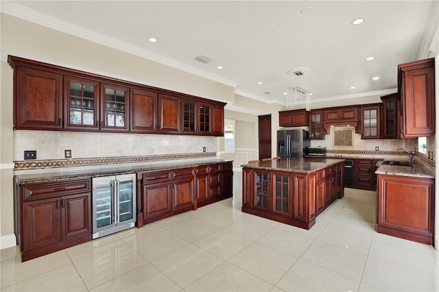 kitchen with sink, beverage cooler, decorative backsplash, ornamental molding, and stainless steel fridge with ice dispenser