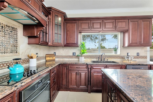 kitchen featuring sink, crown molding, black appliances, and dark stone counters