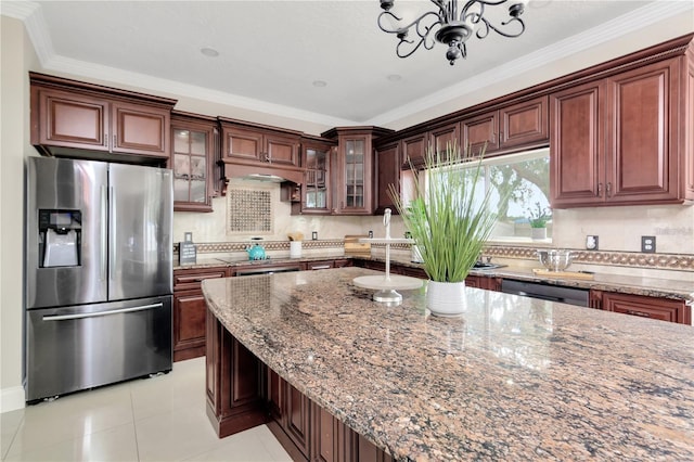 kitchen featuring crown molding, tasteful backsplash, light tile patterned floors, stainless steel appliances, and light stone countertops